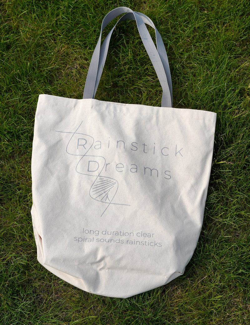 The stand is collapsible and portable. The Stand comes in a canvas tote to carry it anywhere. The tote is printed with our Rainstick Dreams logo and phrase long duration clear spiral sounds Rainsticks.