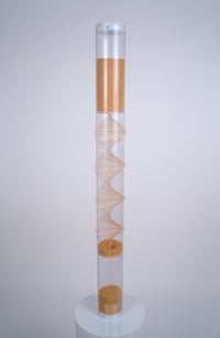 4’ tall clear cylindrical rainstick with a wooden spiral going through it contains amaranth, a tiny tan seed that produces 20 minutes of gentle rain sound as it falls. This XL long duration rainstick instrument by Rainstick Dreams is great for personal use and can be used during meditation or as a sleep aid.