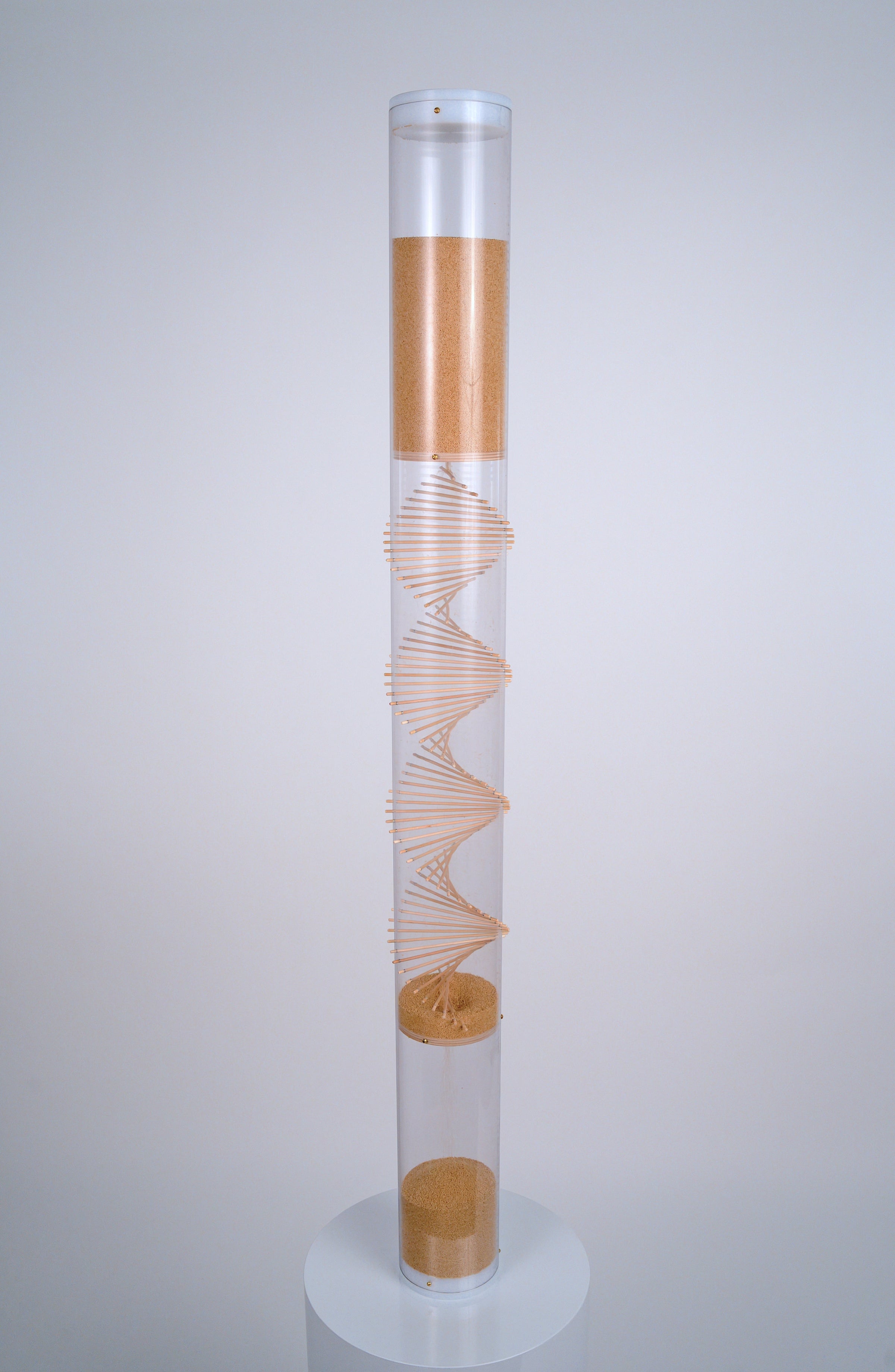 4’ tall clear cylindrical rainstick with a wooden spiral going through it contains amaranth, a tiny tan seed that produces 20 minutes of gentle rain sound as it falls. This XL long duration rainstick instrument by Rainstick Dreams is great for personal use and can be used during meditation or as a sleep aid.