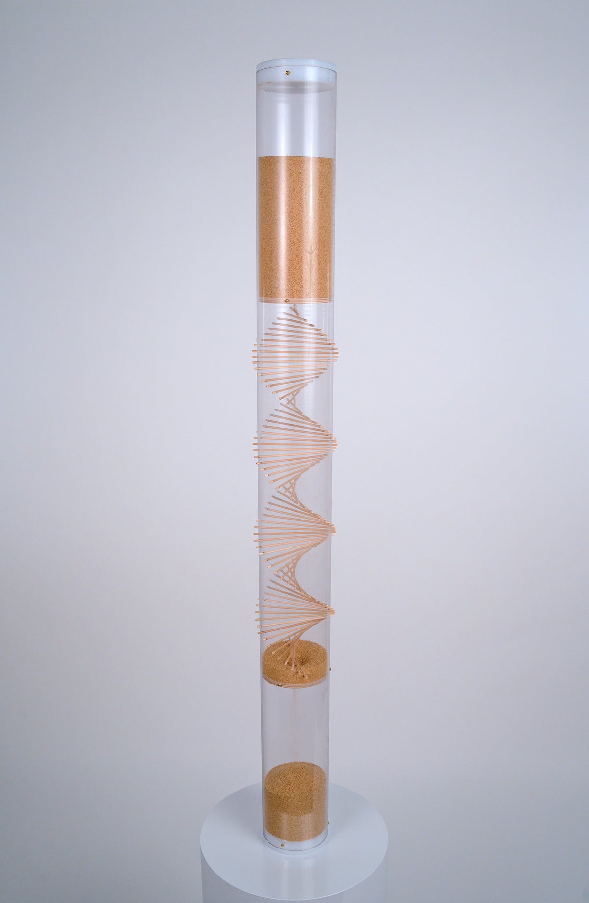 4’ tall clear cylindrical rainstick with a wooden spiral going through it contains amaranth, a tiny tan seed that produces 20 minutes of gentle rain sound as it falls. This XL long duration rainstick instrument by Rainstick Dreams is great for personal use and can be used during meditation or as a sleep aid.